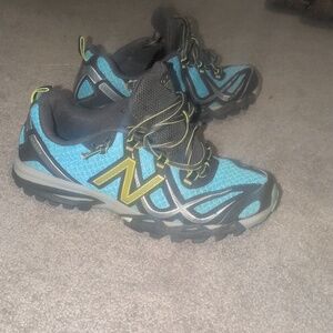 New Balance Blue and Black Trail Running Shoes with Yellow Accents